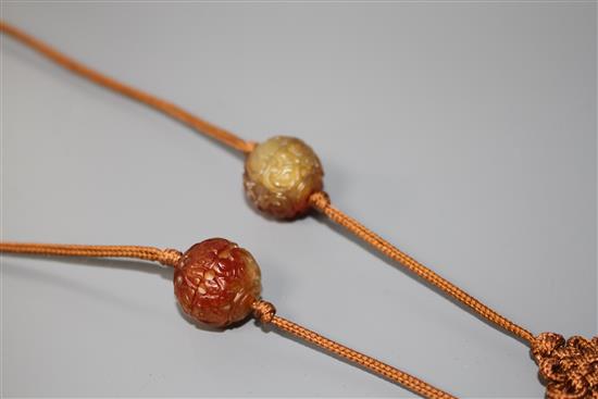 A Chinese reticulated chalcedony pendant and bead necklace, L. 43.5cm